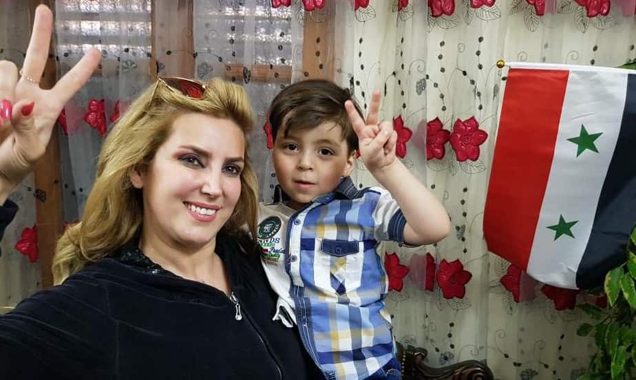 Pro-Assad journalist, Kinana Alloush, poses with Omran. Alloush made headlines herself last year for taking a smailing selfie with the copses of rebel fighters.