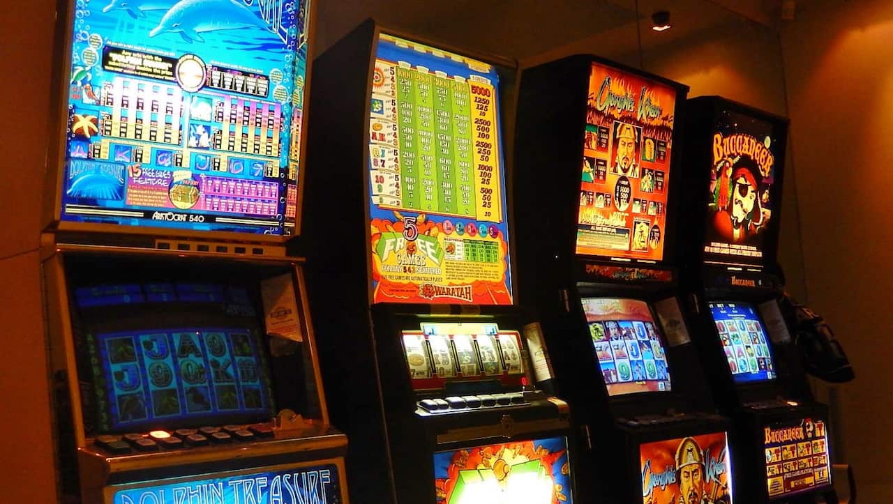 Critics say new caps on pokie machines in NSW will not curb addictions.