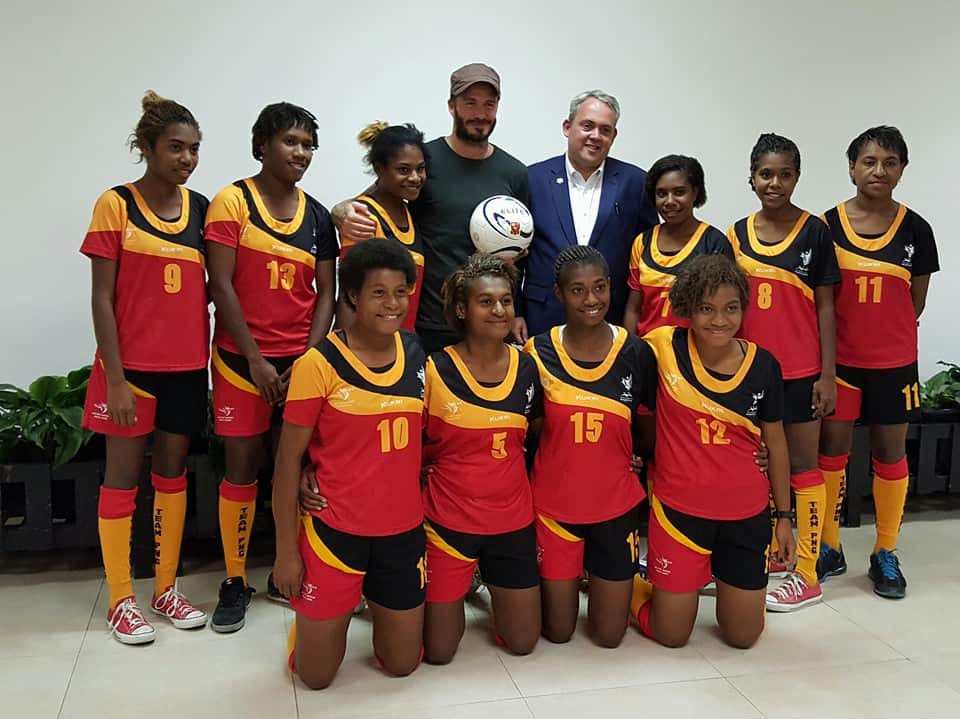 The Papua New Guinea Under 20 women's team with British soccer star David Beckham and PNG Sports Minister  Justin Tkatchenko.