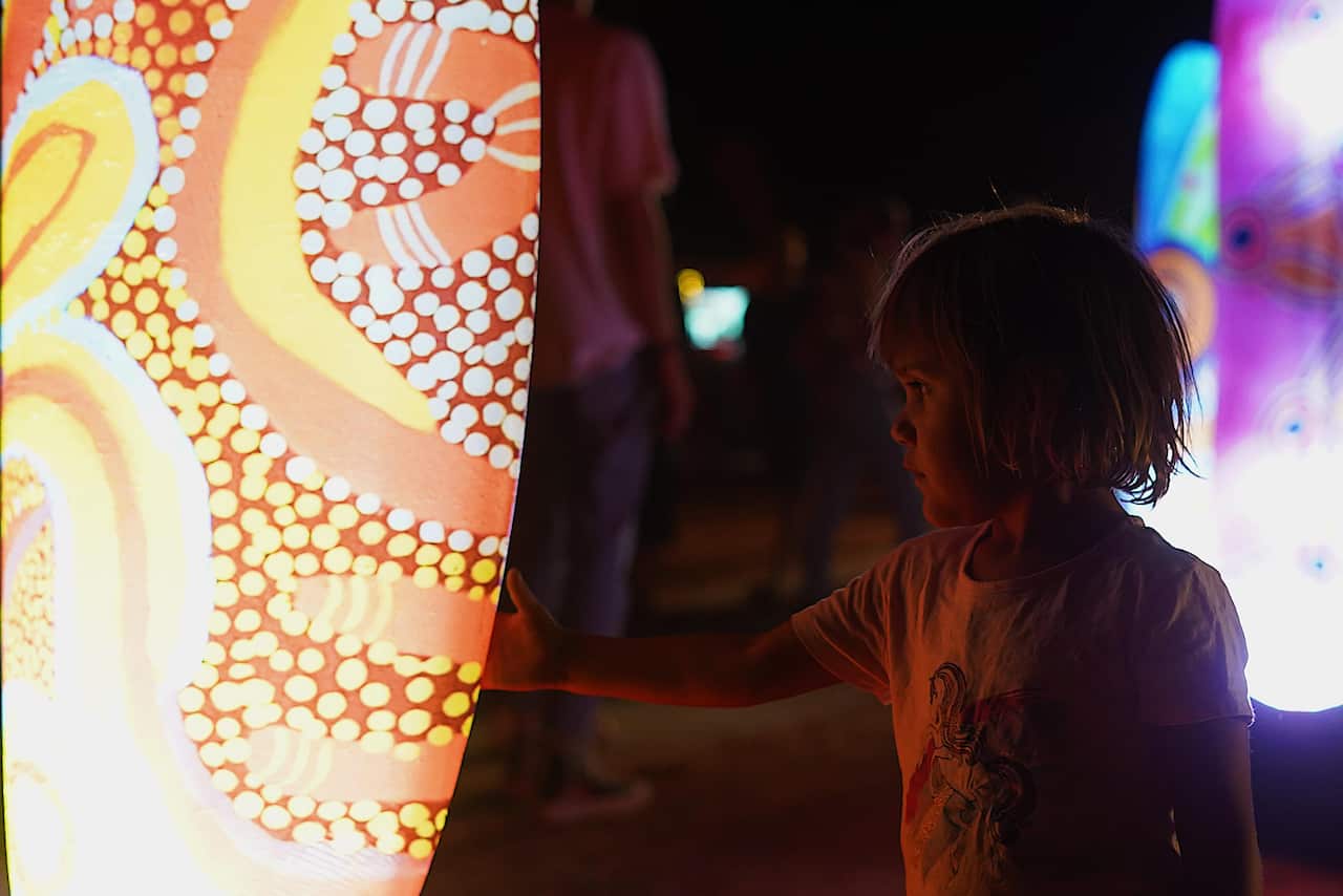 Parrtjima runs over 10-nights, across a two-kilometre stretch of the West MacDonald Ranges and features a 160,000-watt light display.