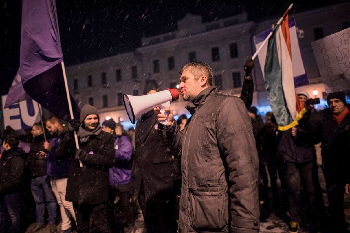 Independent MP Akos Hadhazy speaks to participants during an anti-government demonstration