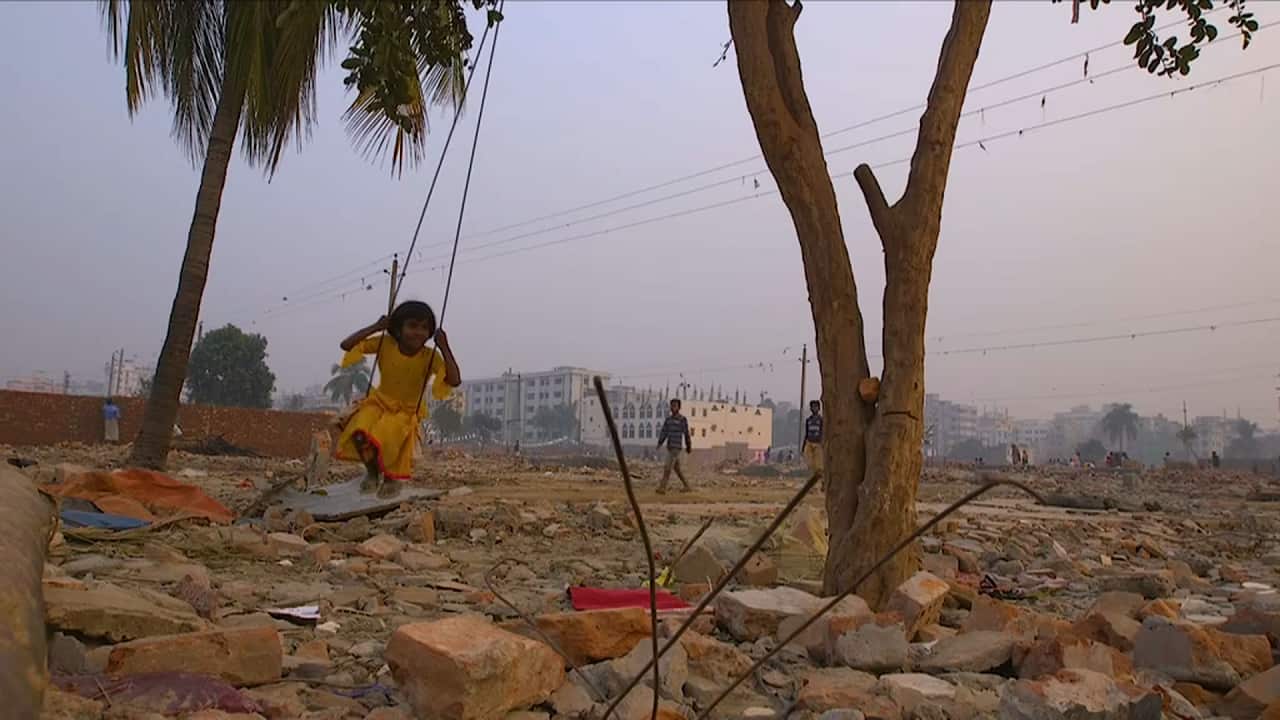 A child plays in one of Dhaka's poorest neighbourhoods.