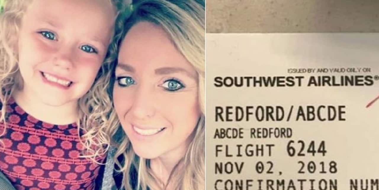 Abcde and Traci Redford with the boarding pass.