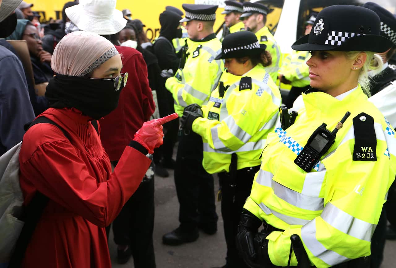 A protester confronts a police officer during a Black Lives Matter protest on Saturday.