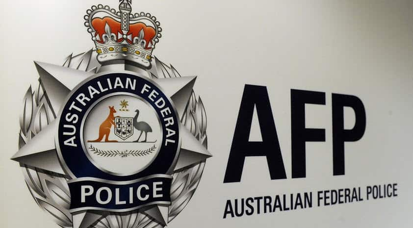 A wall with a sign on it that reads: "AFP: Australian Federal Police"