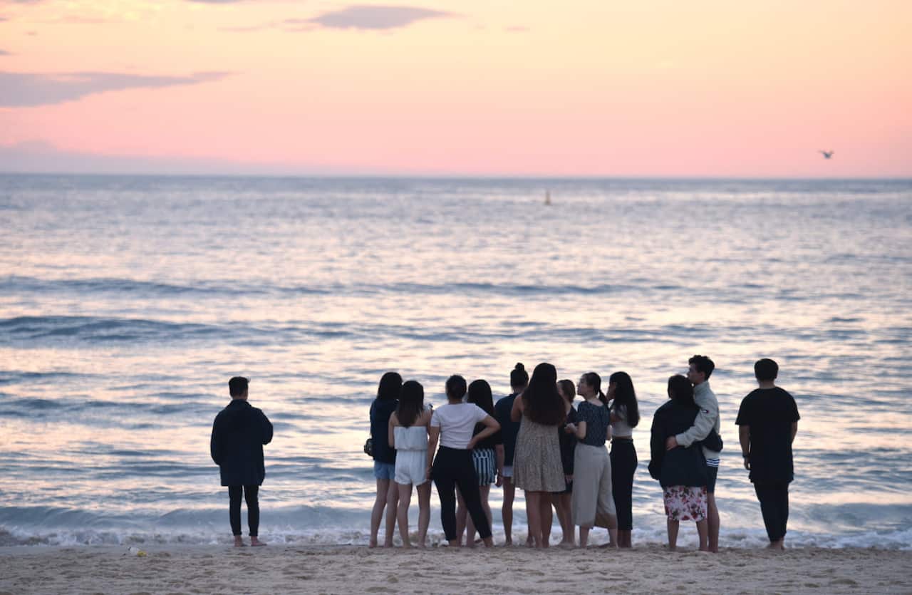 People gather on Bondi Beach in Sydney, January 1, 2018.