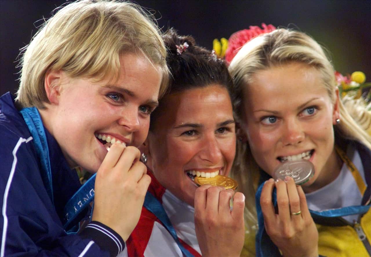 Tatiana Grigorieva, right, with her Olympic silver medal on 'Magic Monday'.
