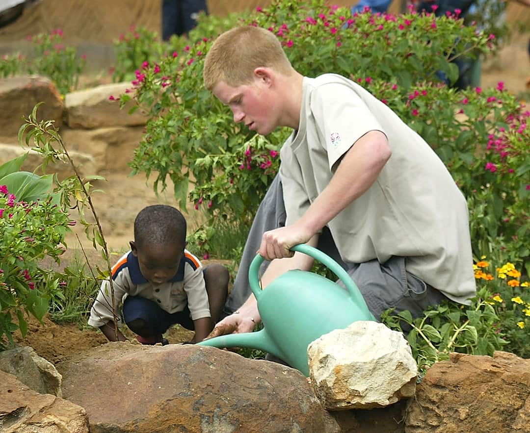 The pair plant a fruit tree in 2004.