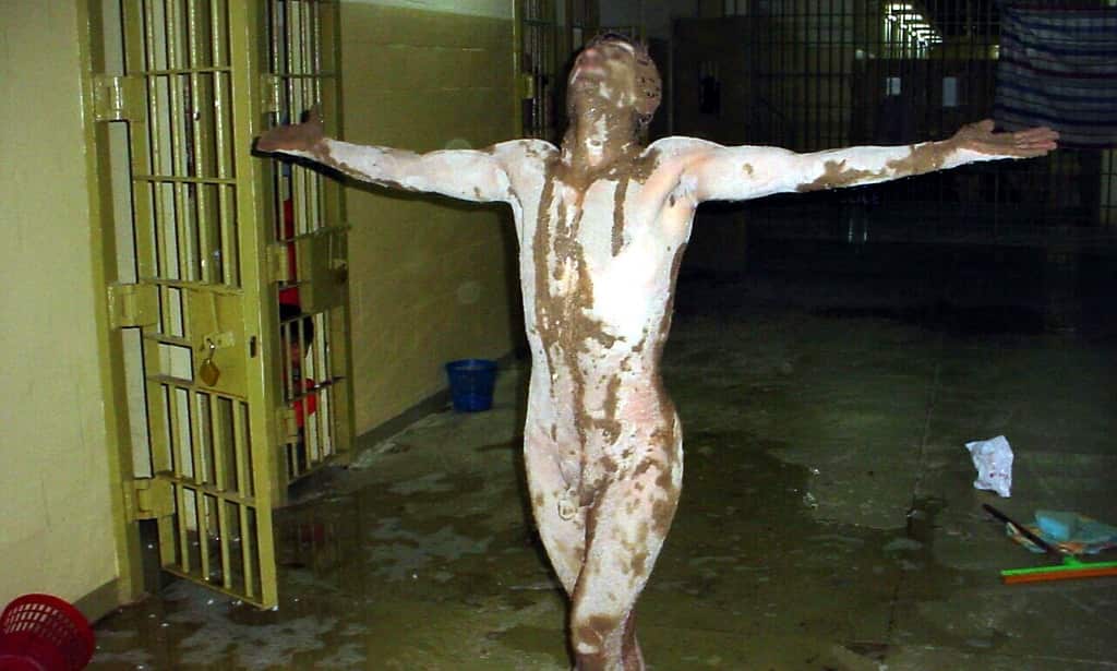 A photo released by SBS' Dateline on 15 February, 2006 which allegedly depicts a psychologically disturbed prisoner in Iraq's notorious Abu Ghraib prison, covered in a brown substance in Baghdad in 2004.