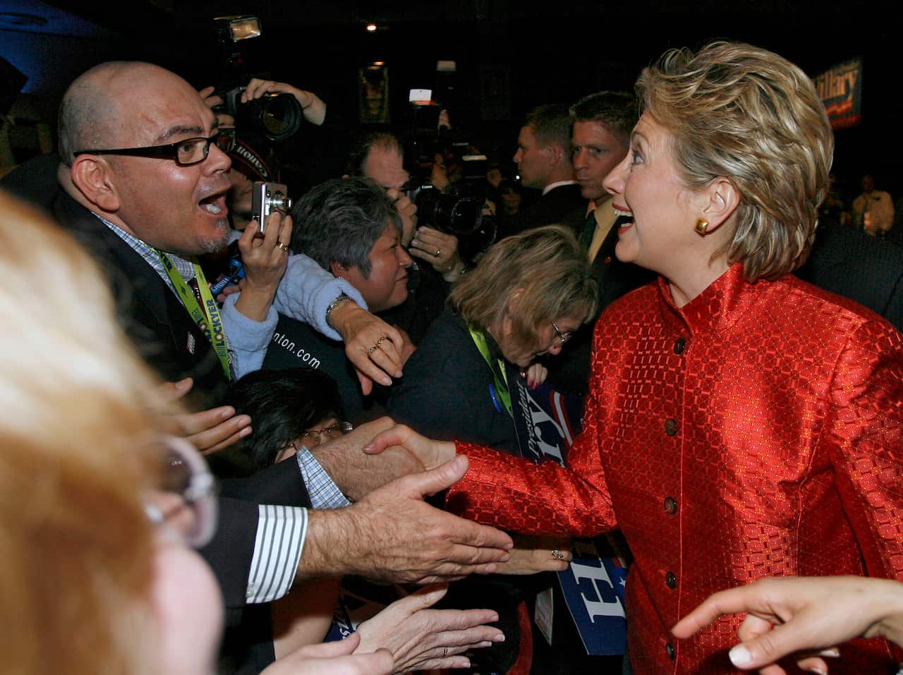 Democratic presidential hopeful Sen. Hillary Rodham Clinton, D-N.Y., right, shakes hands with supporter Chris Fuentes, left, after her address the California Democratic Convention in San Diego, Saturday, April 28, 2007. (AP Photo/Denis Poroy)