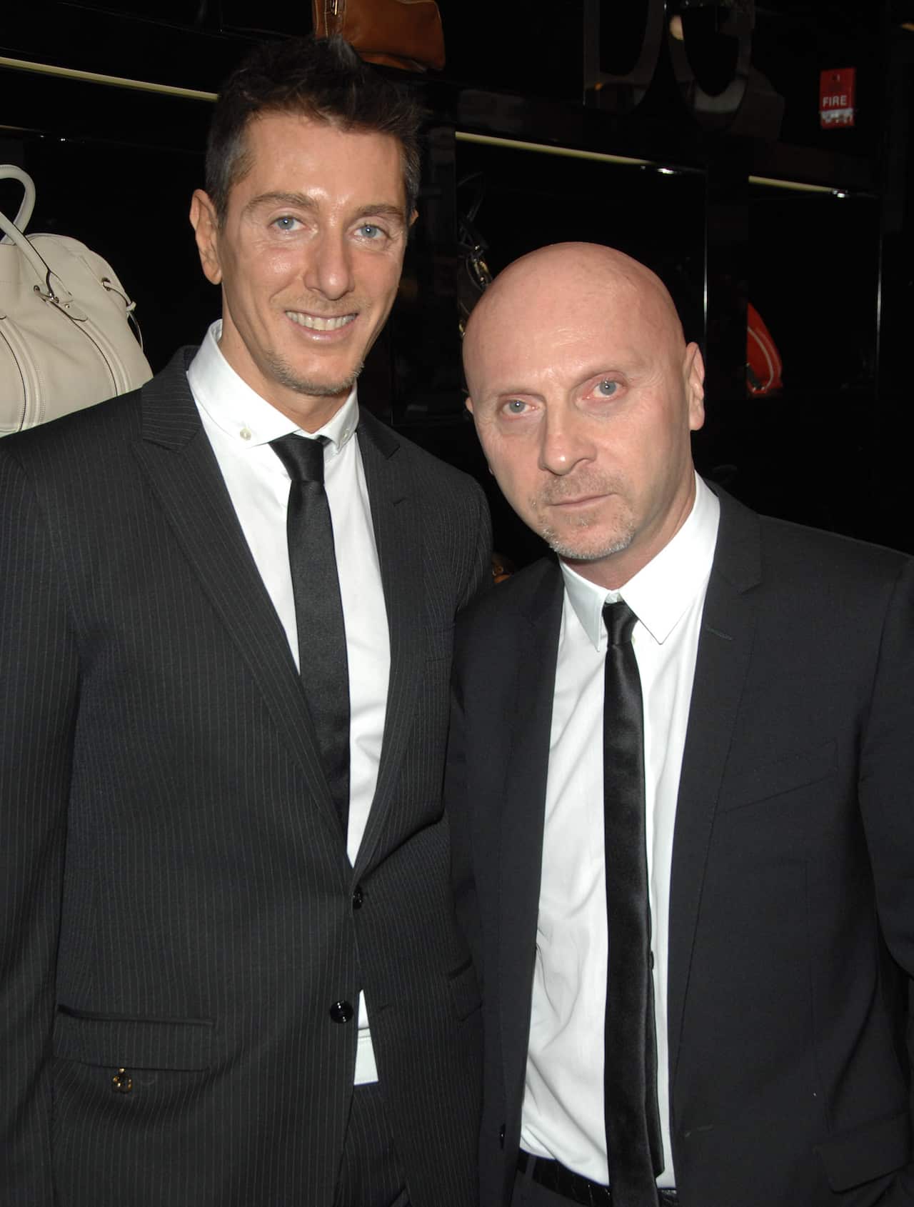 Designers Stefano Gabanna, left, and Domenico Dolce pose for pictures at the new Dolce & Gabbana women's store on Madison Avenue, Monday, Dec. 3, 2007, in New York. (AP Photo/Peter Kramer)