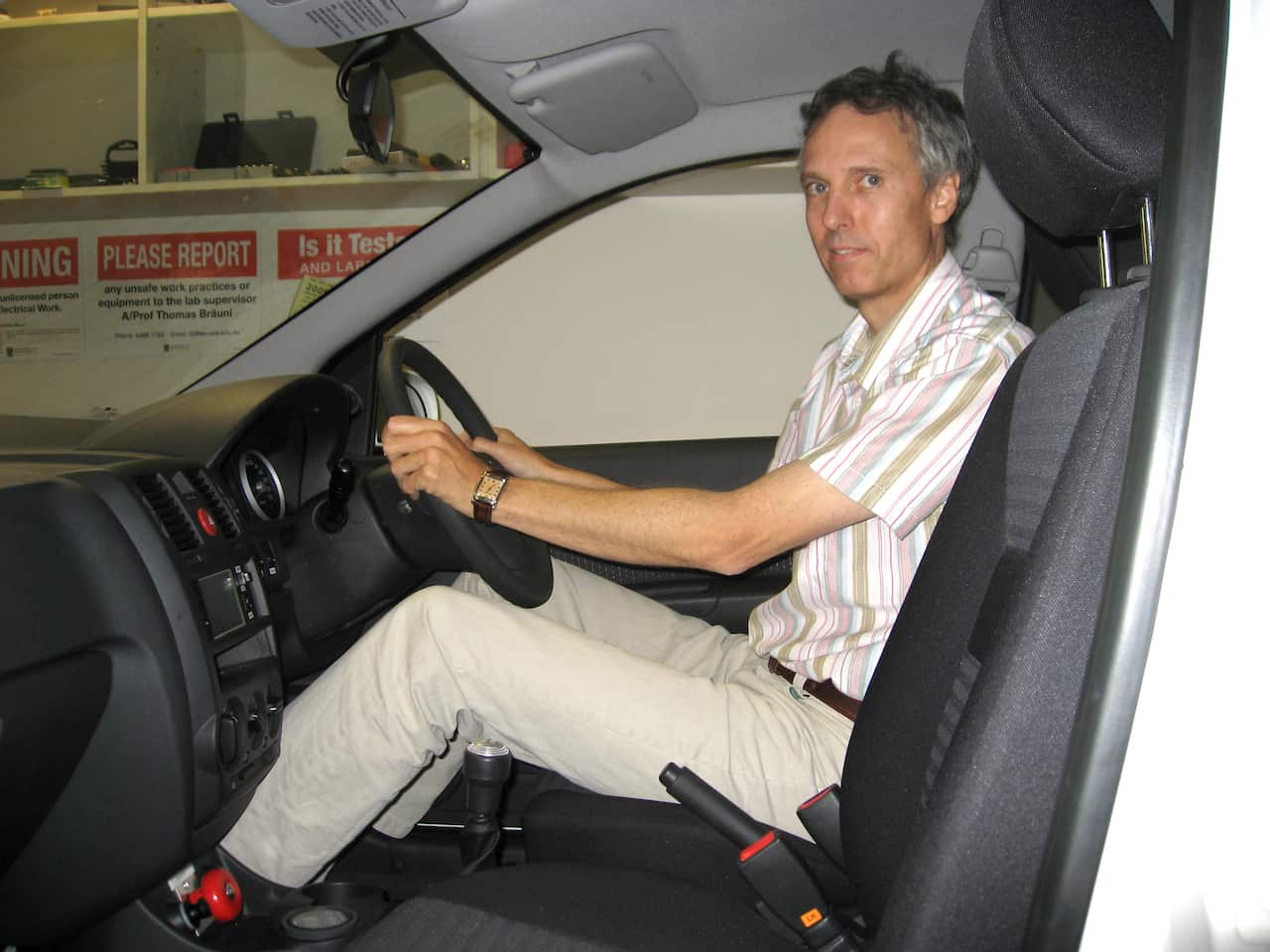 University of Western Australia Professor Thomas Braunl at the wheel of the electric-converted Hyundai Getz. (AAP)