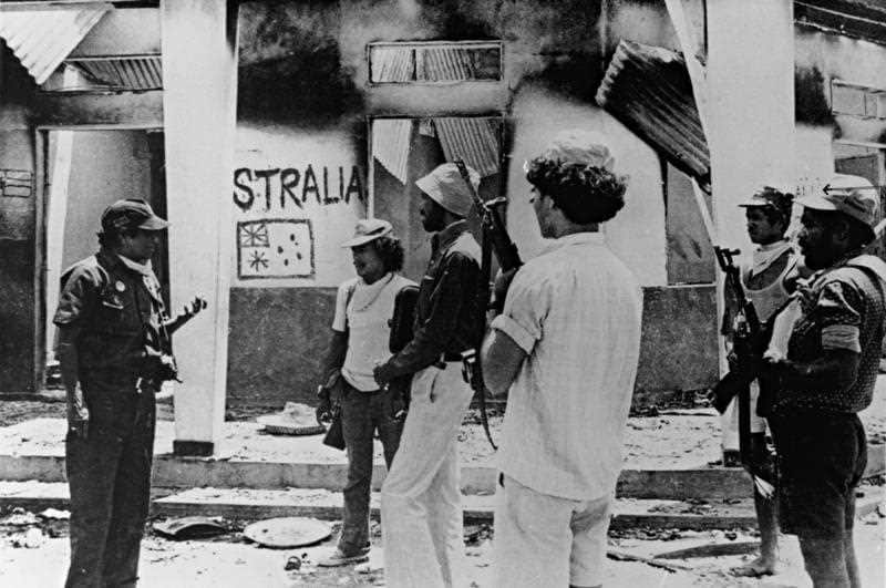 Photo from April/May 1976 supplied by the National Archives of Australia, Thursday, Sept. 10, 2009, showing Indonesian troops at the house in which Australian journalists Greg Shackleton and Malcolm Rennie, cameramen Gary Cunningham and Brian Peters, and 