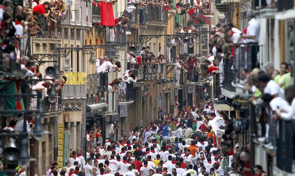 Runners take to the streets: a 23-year-old Australian woman was gored in her thorax during the bull chase of the Fiesta de San Fermin in 2013. (AAP)
