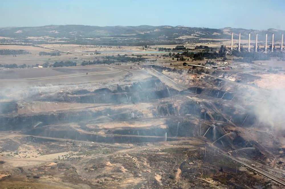 An image obtained Wednesday, February 26, 2014 of firefighters battling a blaze at the Hazelwood open-cut mine in Melbourne. Police fear the firebug who lit the blaze that's burning at the Victorian coal mine will strike again on high fire-danger days. 