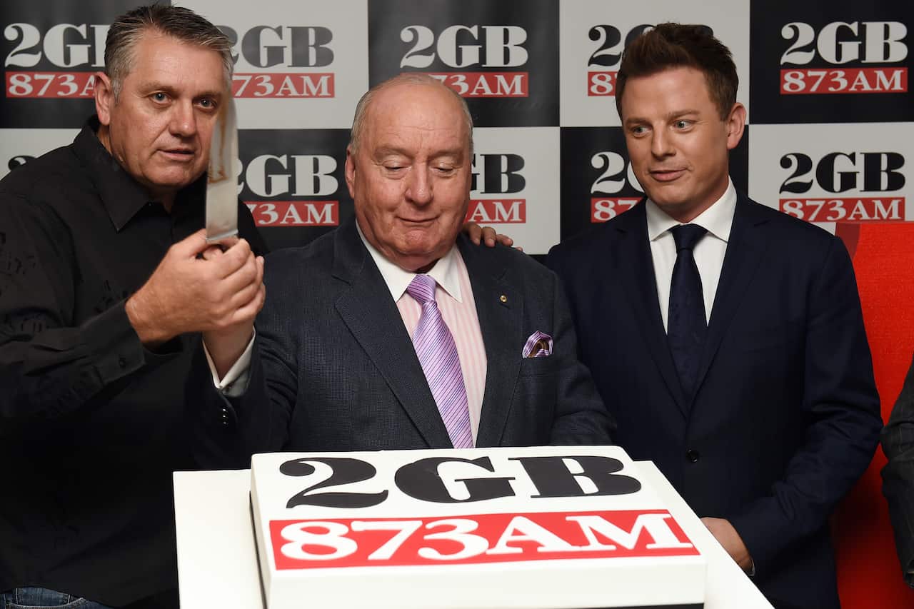 (L to R) 2GB radio hosts, Ray Hadley, Alan Jones and Ben Fordham cut a cake to celebrate 2GB's 10 straight years on 3 June, 2014.