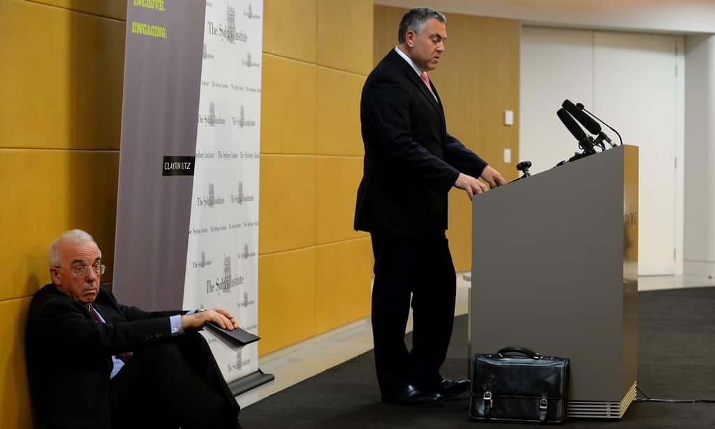 Sydney Institute Executive Director Gerard Henderson sits on the floor as Treasurer Joe Hockey delivers a speech to The Sydney Institute, in Sydney, Wednesday, June 11, 2014. (AAP)