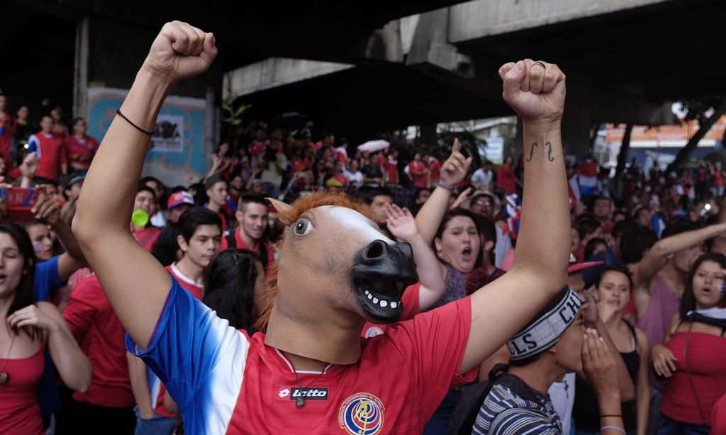 Uh ... another real fan. Costa Rica supporters celebrate in San Jose, Costa Rica, 24 June 2014, after their team qualified for the Round of 16 of the FIFA World Cup 2014. (EPA)