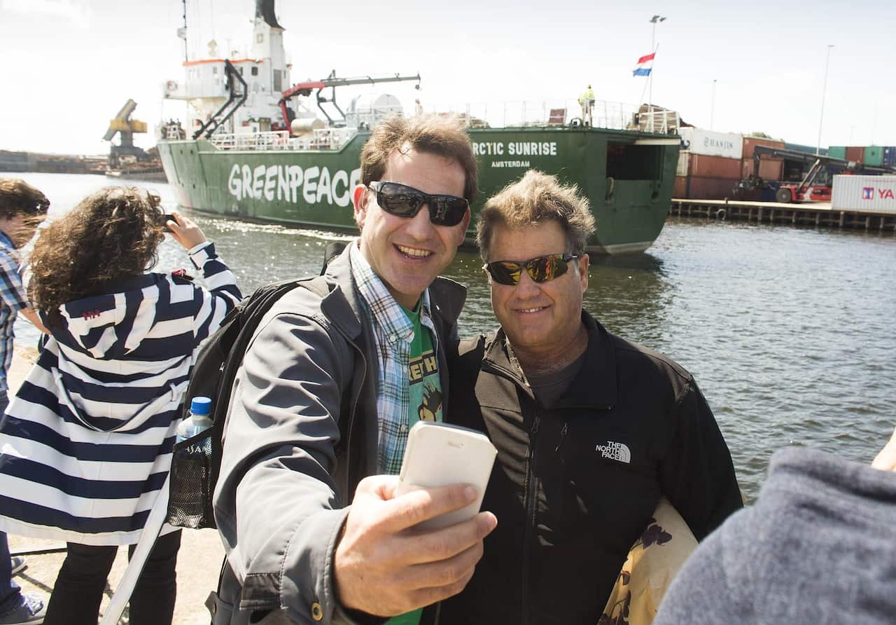 Miguel Hernan and Pete Willcox in front of the Arctic Sunrise 
