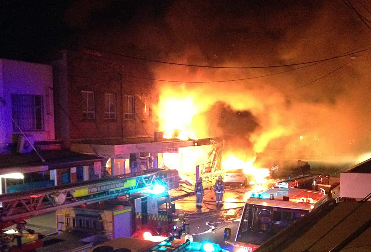 Emergency services attend the site of an explosion and fire on Darling Street in Rozelle (AAP)
