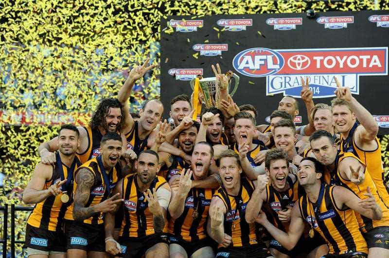 Hawthorn players celebrate after winning the AFL Grand Final match against the Sydney Swans at the MCG in Melbourne.