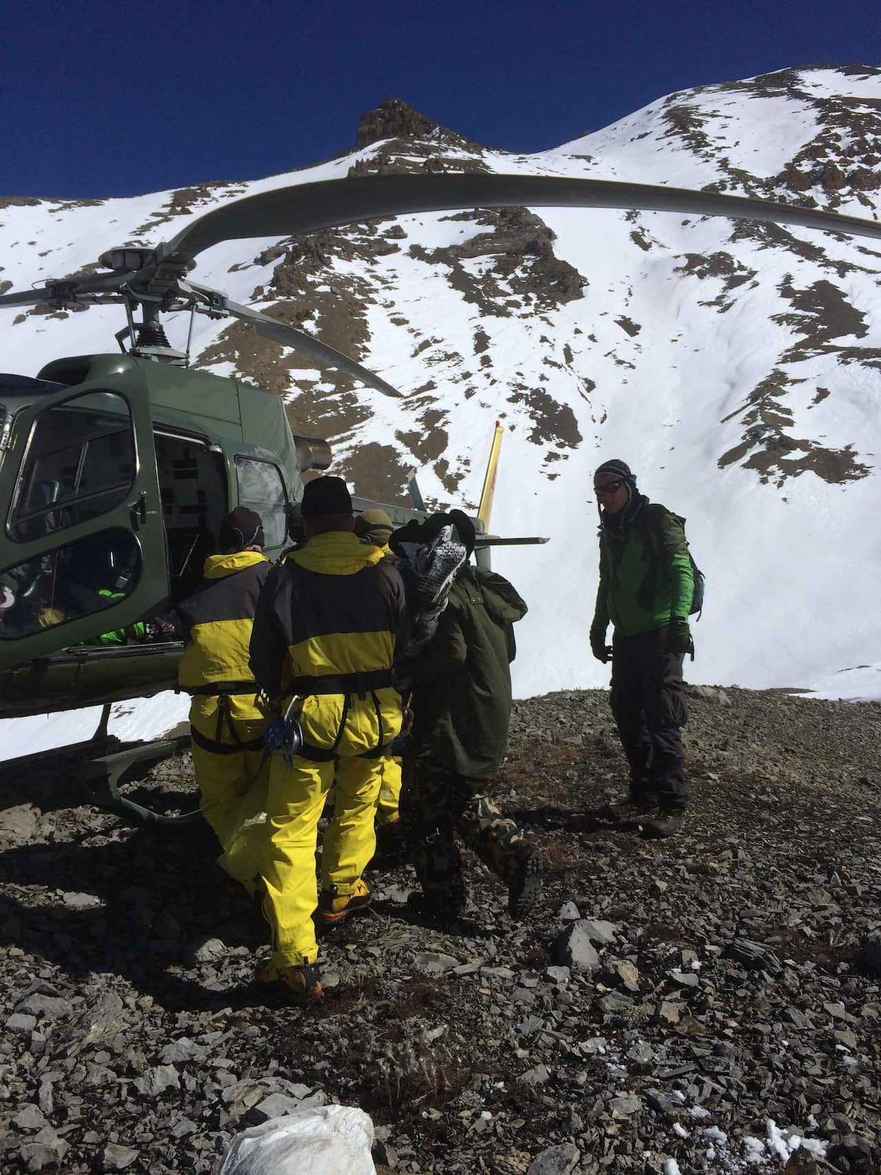 Rescue members carry dead bodies of trekkers from the Thorung La mountain pass on the Annapurna Circuit,in Manang District,Nepal. (AAP)