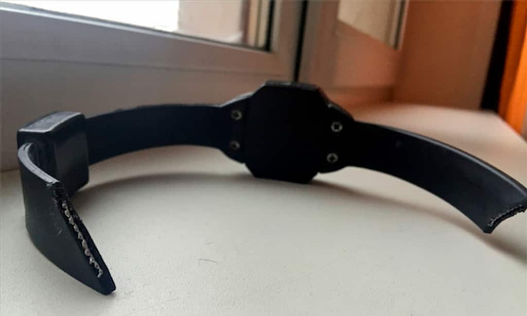 In this handout photo taken on Monday, Jan. 5, 2015, the electronic tagging bracelet is displayed at Russian anti-corruption crusader Alexei Navalny's home in Moscow after he cut it off.