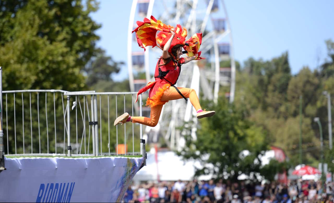 Deb Ware as Birdwoman jumps into the Yarra River during the annual Birdman event as part of the Moomba Festival in Melbourne (AAP)