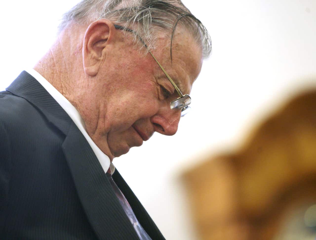 Former Iowa state legislator Henry Rayhons reacts after hearing a not guilty verdict in his trial.