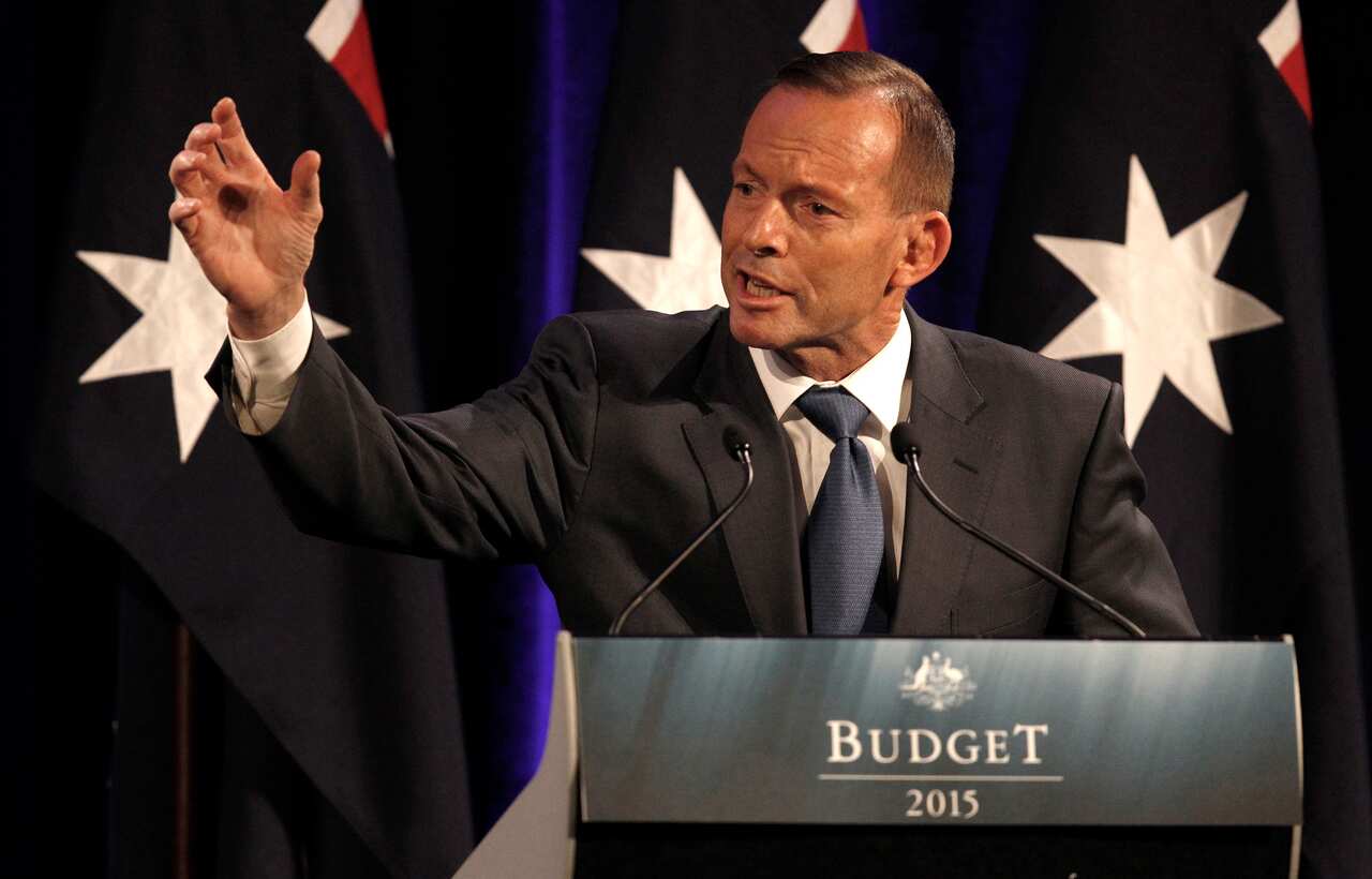 Australian Prime Minister Tony Abbott gestures as he speaks on stage during a Liberal Party NSW Division post budget luncheon in Sydney, Friday, May 15, 2015. (AAP Image/David Moir) NO ARCHIVING