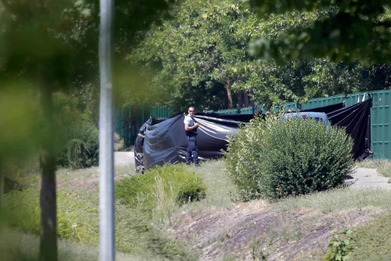 Emergency personnel work at the scene of a suspected Islamist attack, outside the Air Products factory in Saint-Quentin-Fallavier, southern France, 26 June 2015. (EPA)