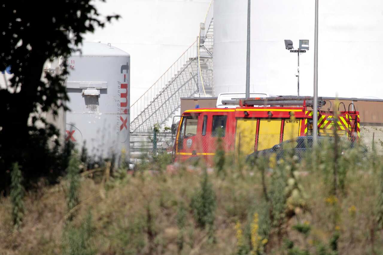 Emergency personnel work at the scene of a suspected Islamist attack, outside the Air Products factory in Saint-Quentin-Fallavier, southern France, 26 June 2015. (EPA)