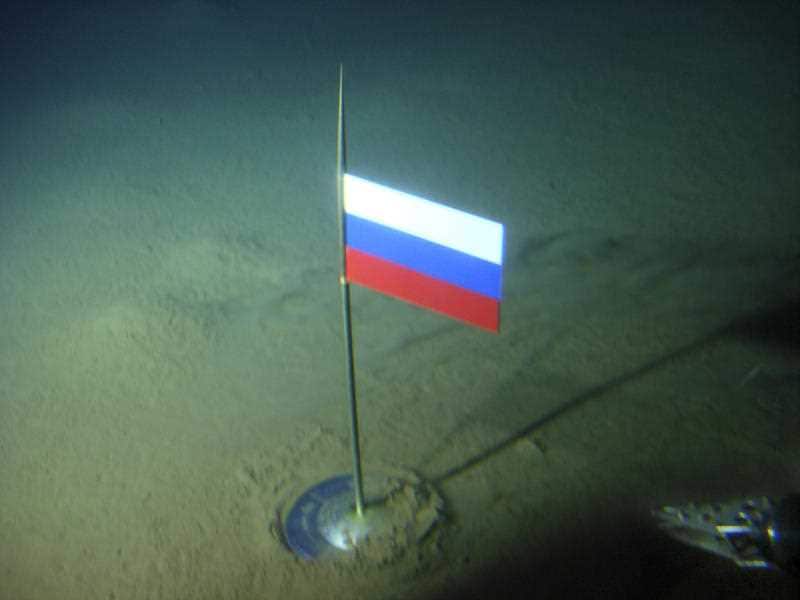 A titanium capsule with the Russian flag is seen seconds after it was planted by the Mir-1 mini submarine on the Arctic Ocean seabed under the North Pole. Aug. 2, 2007