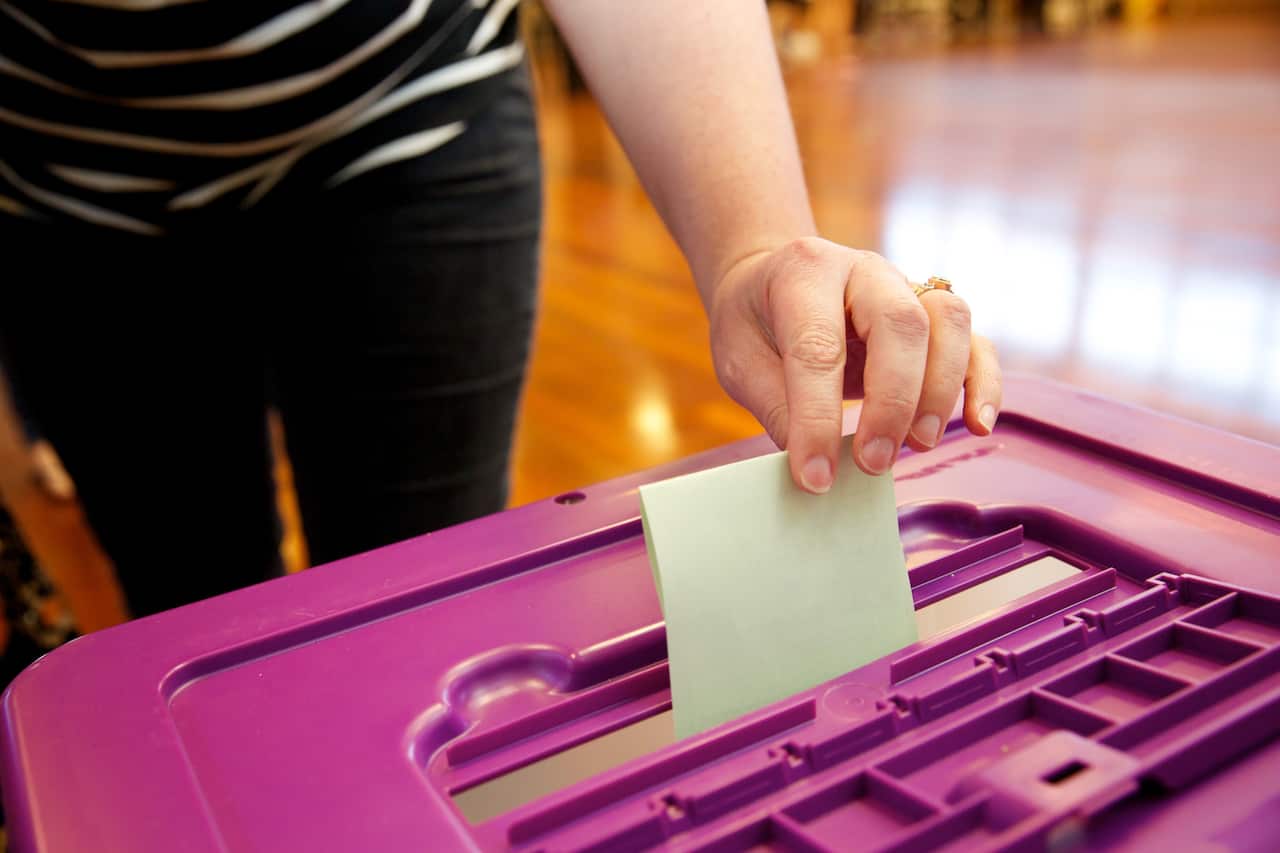 Voters posting their votes