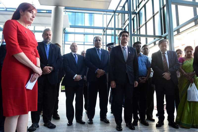 Members of the local community light candles at a vigil for Curtis Cheng in Sydney on Wednesday, Oct. 14, 2015. Mr Cheng, a police accountant, was shot by 15-year-old Farhad Jabar Khalil Mohammad outside the NSW police headquarters on Friday, October 2. (
