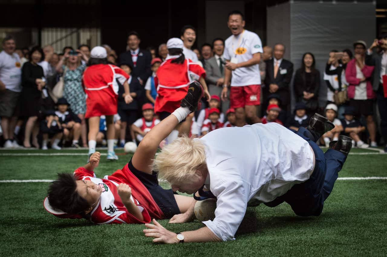 Mayor of London Boris Johnson knocks over 10-year-old Toki Sekiguchi.