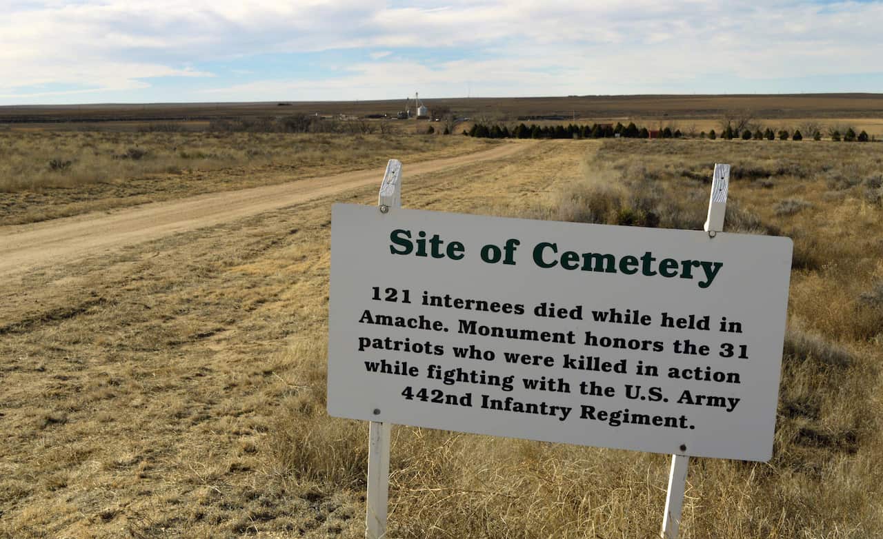 A sign pointing the way to the cemetery of Camp Amache, the site of a former World War II-era Japanese-American internment camp, in Granada