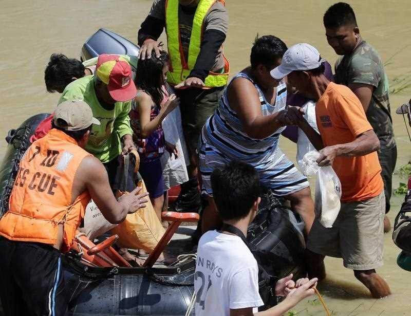 Filipino soldiers conduct a rescue mission at the flood-hit town of Calumpit, Bulacan province, northern Manila