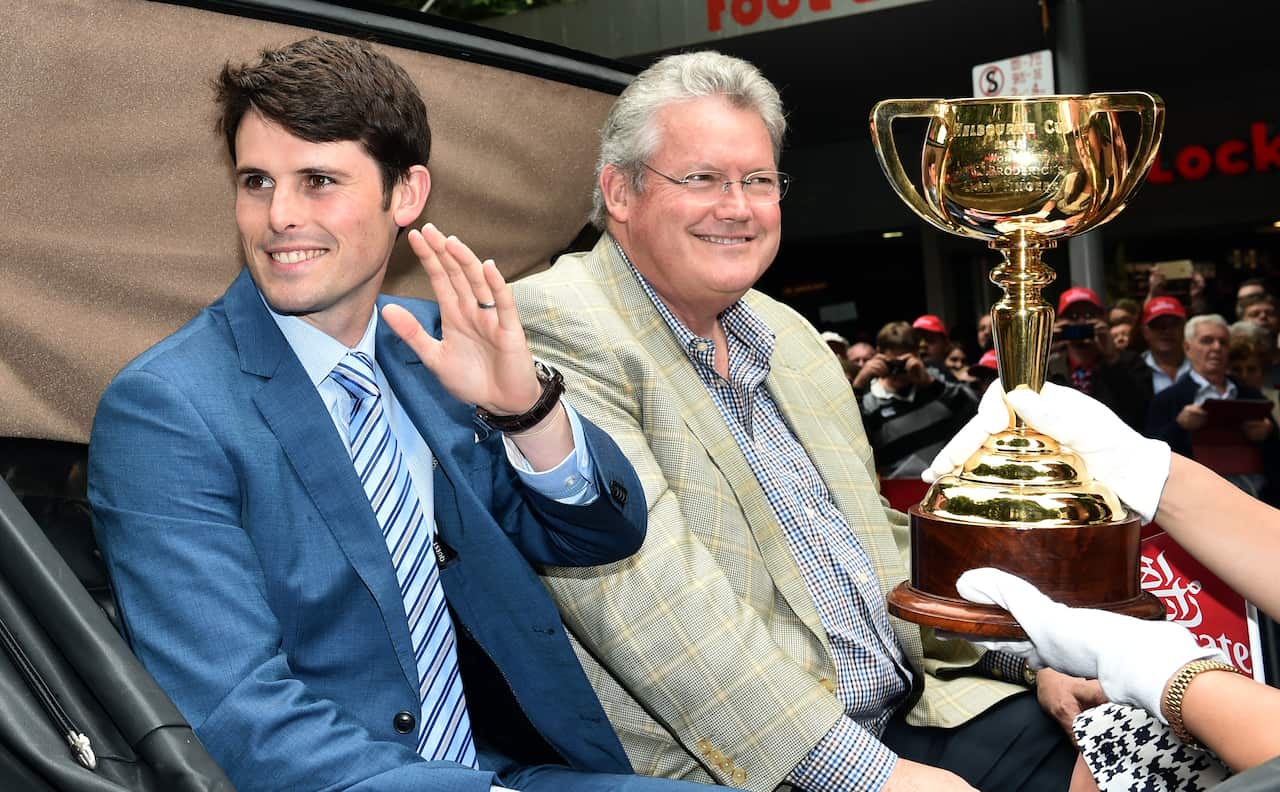 James (left) and Anthony Cummings participate in the Melbourne Cup Parade in Melbourne, Monday, Nov. 2, 2015. The Melbourne Cup will be held on November 3. (AAP Image/Julian Smith) NO ARCHIVING