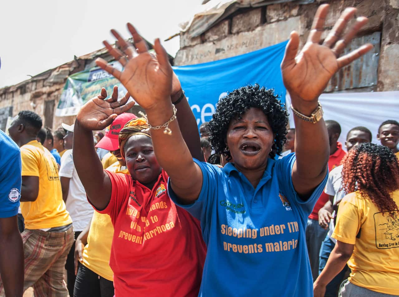 Women celebrate as their country is declared Ebola free in the city of Freetown Sierra Leone