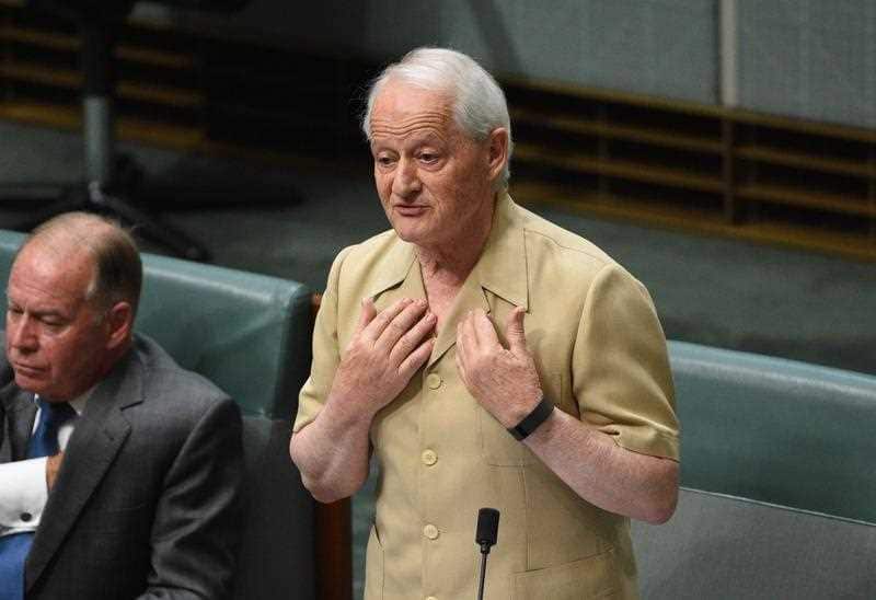 Liberal Member for Berowra Philip Ruddock wears a safari suit for charity in the chamber at Parliament House in Canberra, Wednesday, Dec. 2, 2015. (AAP Image/Mick Tsikas) NO ARCHIVING