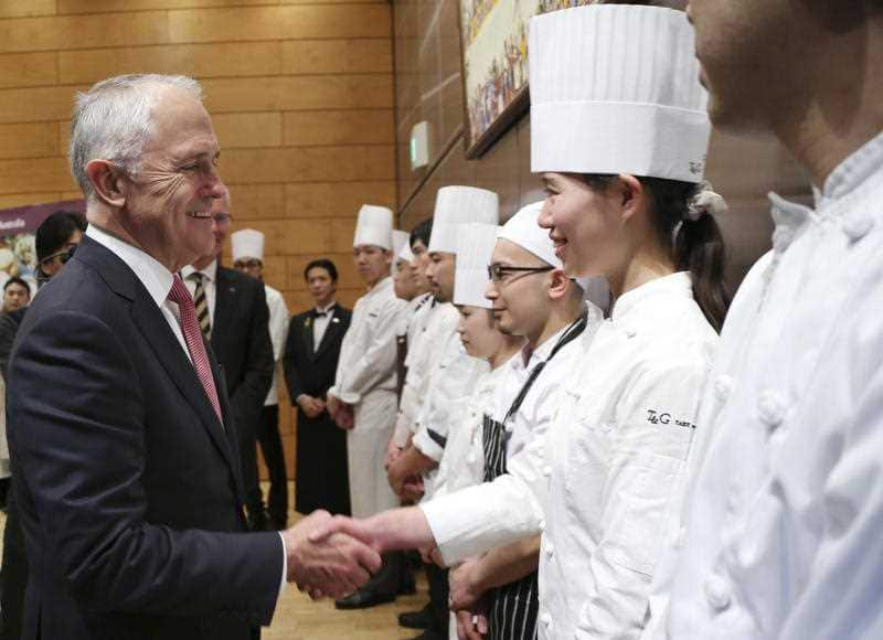 Australian Prime Minister Malcolm Turnbull, left, shakes hands with Japanese chefs during an event of "Taste of Australia"