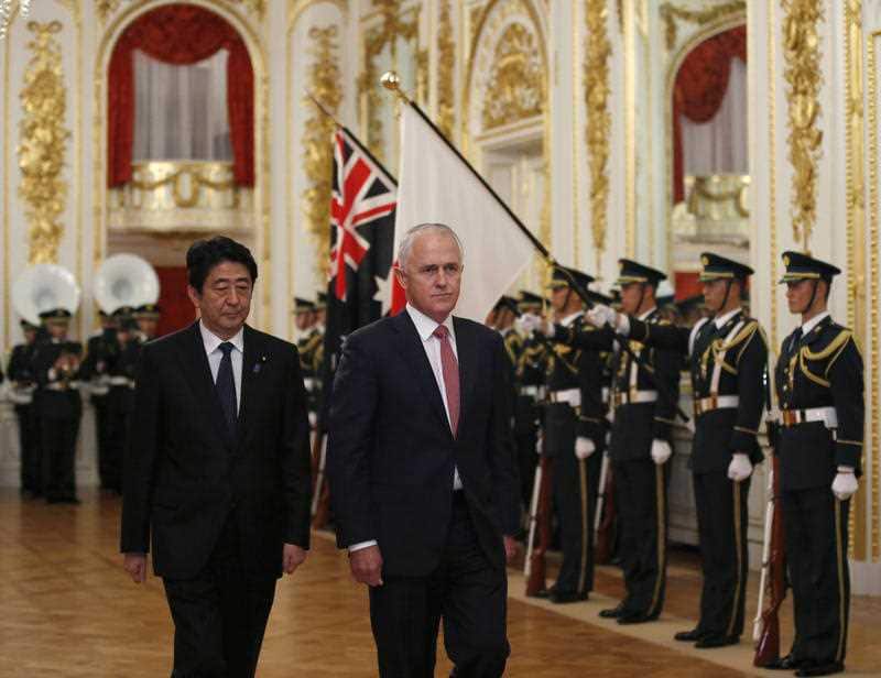 Australian Prime Minister Malcolm Turnbull, accompanied by his counterpart Shinzo Abe