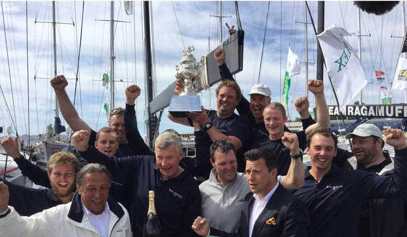 Crew from the NSW boat Balance celebrate after being the overall winner of the 2015 Sydney to Hobart yacht race, Hobart