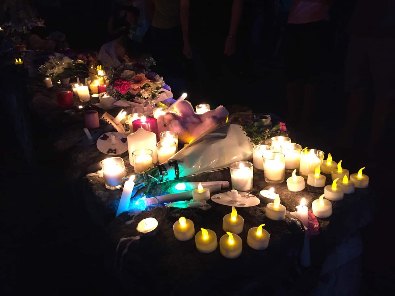 More than 200 people have turned out to a candlelight vigil for a two-month-old baby who died in an alleged stabbing attack in Brisbane's south, Thursday, Jan. 7, 2016. 