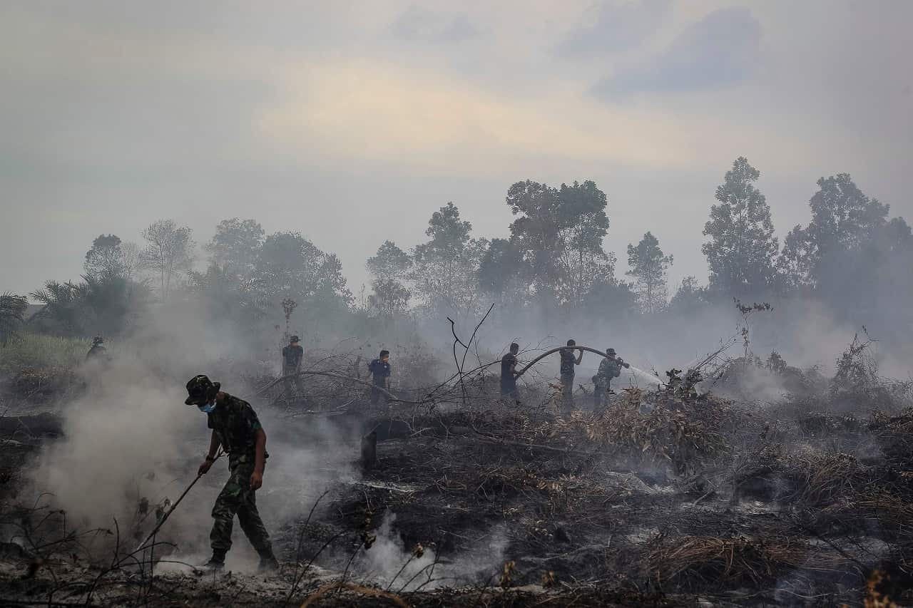 Indonesian military spray water on forest burned area at Kampar, Riau, Indonesia.