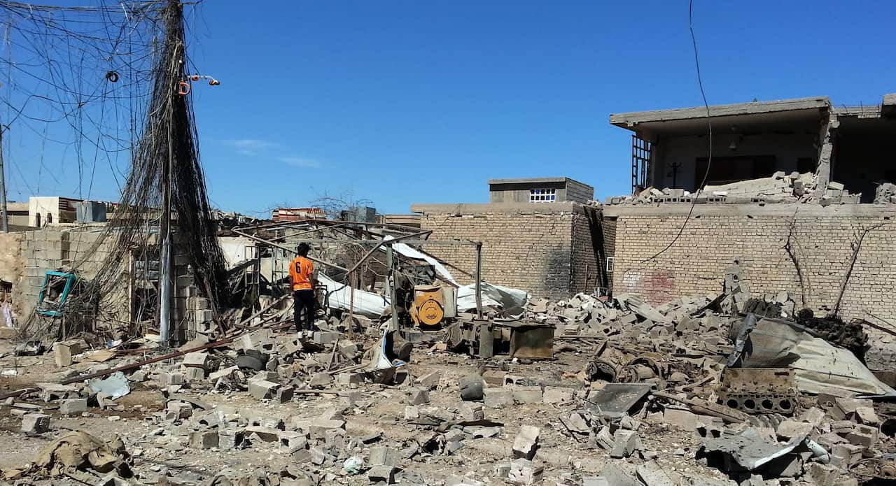 An Iraqi man inspects the rubble of a house destroyed in an apparent airstrike carried out by the Iraqi army on Fallujah. (EPA)