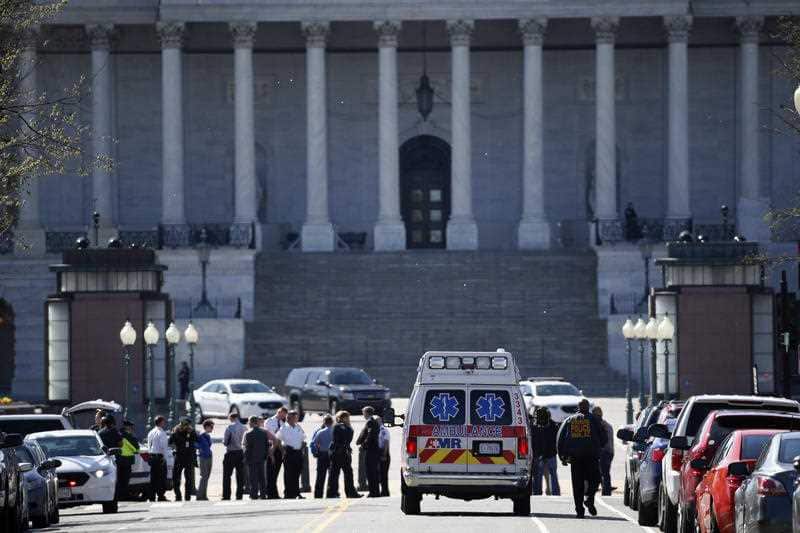 Law enforcement and rescue vehicle are seen on a street leading to Capitol Hill in Washington, Monday, March 28, 2016
