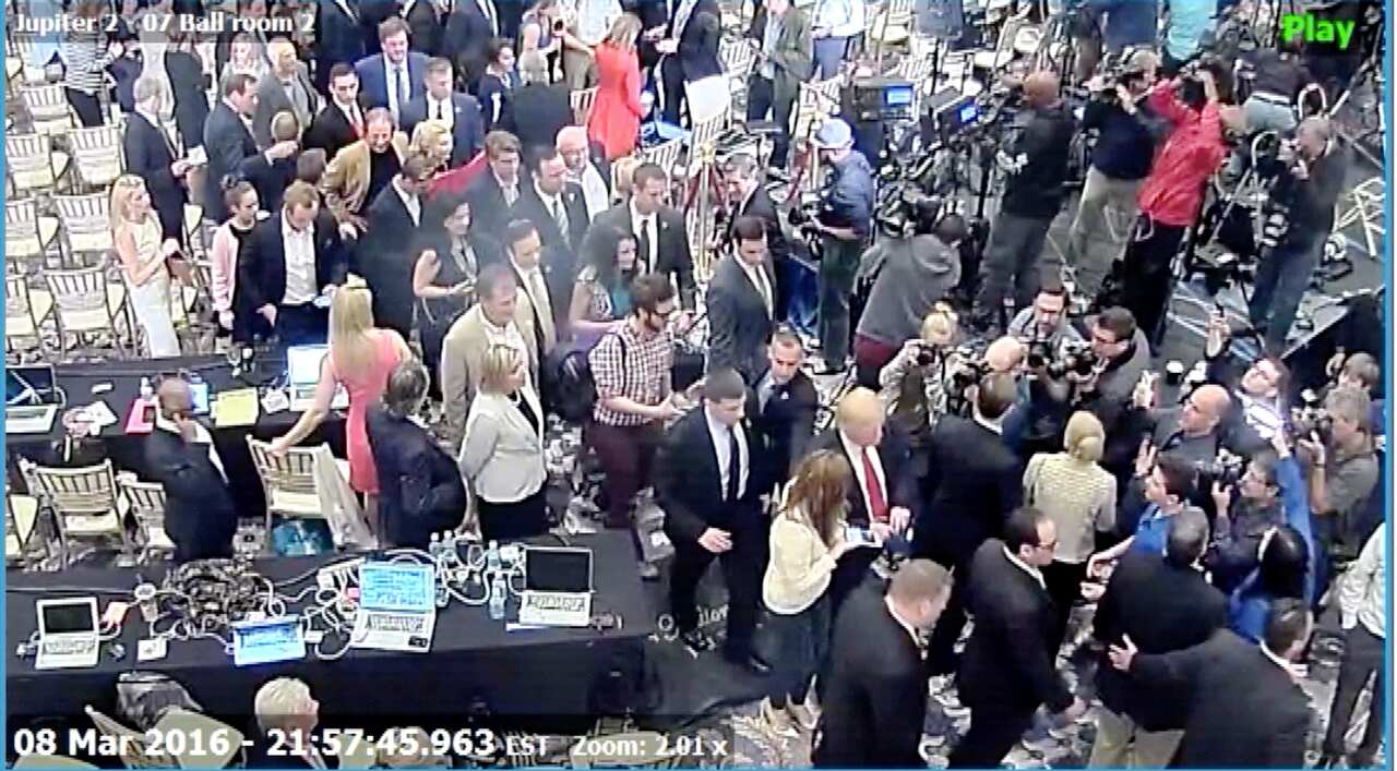 Manager Corey Lewandowski allegedly grabbed former Breitbart reporter Michelle Fields (wearing white shirt at bottom C next to Trump in dark suit and red tie)