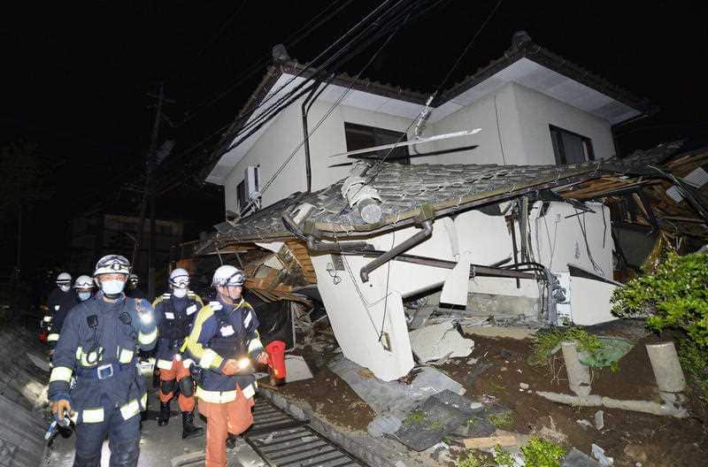 A house collapses following the earthquake in Mashiki, near Kumamoto city, southern Japan, early Friday, April 15, 2016.